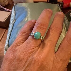 Elegant Silver and Sleeping beauty Turquoise Ring with blue topaz stones on side